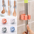 Mop and broom holder in use